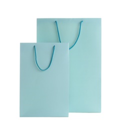 Light blue paper shopping bags isolated on white