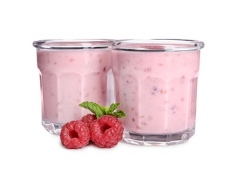 Tasty fresh raspberry smoothie in glasses on white background