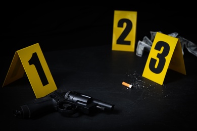 Crime scene markers and evidences on black background