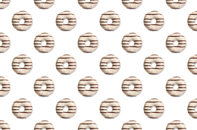 Image of Creative pattern design of glazed donuts on white background