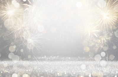 Abstract festive background with fireworks, bokeh effect. New Year celebration
