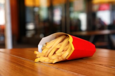 MYKOLAIV, UKRAINE - AUGUST 11, 2021: Big portion of McDonald's French fries on table in cafe