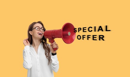 Special offer. Young woman with megaphone on yellow background