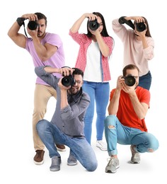 Group of professional photographers with cameras on white background