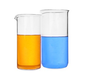 Photo of Glass beakers with colorful liquids on white background