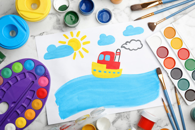 Flat lay composition with child's painting of ship on white marble table