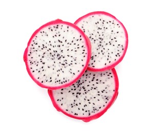 Slices of delicious pitahaya fruit on white background, top view
