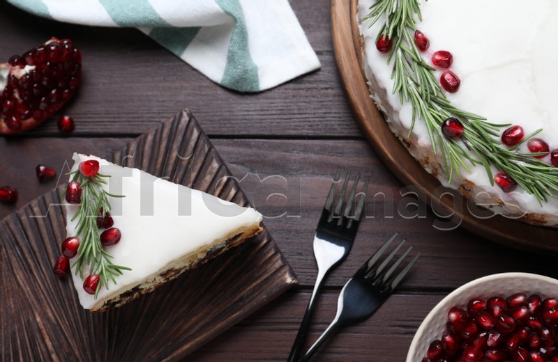 Photo of Traditional homemade Christmas cake served on wooden table, flat lay