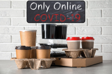 Various takeout containers on table. Online food delivery service