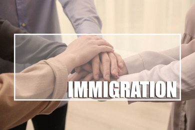 Immigration concept. People putting hands together, closeup view