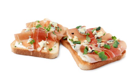 Delicious sandwiches with prosciutto, microgreens and cheese on white background