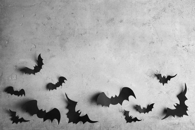 Paper bats on light grey background, flat lay with space for text. Halloween decor