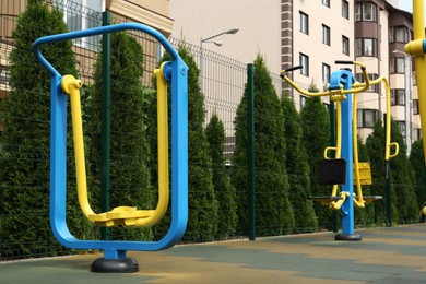Empty outdoor playground with air walker in residential area