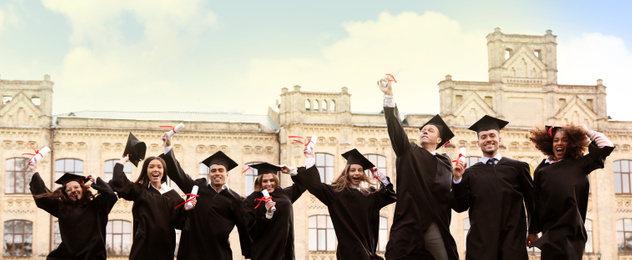 Happy students with diplomas near campus. Banner design