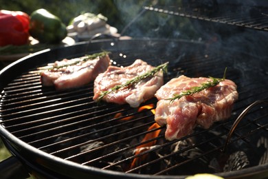 Cooking meat on barbecue grill outdoors, closeup
