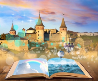 Fantasy worlds in fairytales. Book, hot air balloons and enchanted castle on background