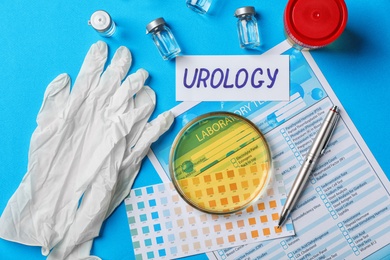 Flat lay composition with urine sample and test form on color background. Urology concept