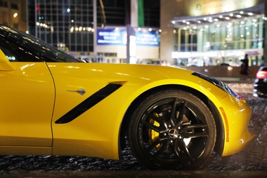 DUBAI, UNITED ARAB EMIRATES - NOVEMBER 03, 2018: Luxury car on city street at night