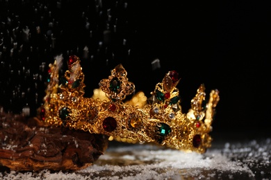 Beautiful golden crown with gems on black background. Fantasy item