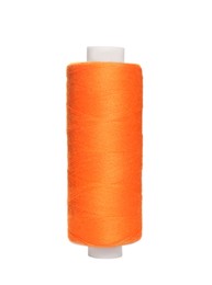 Spool of orange sewing thread isolated on white