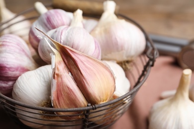Fresh garlic in basket, closeup. Organic product