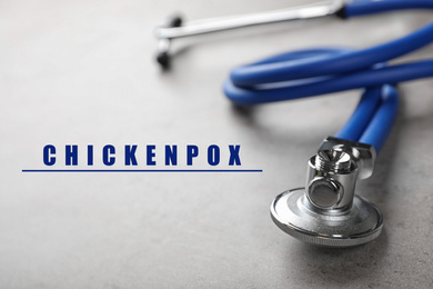 Image of Stethoscope on grey background, closeup. Chickenpox disease 