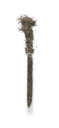 Glass tube with dry herb on white background, top view