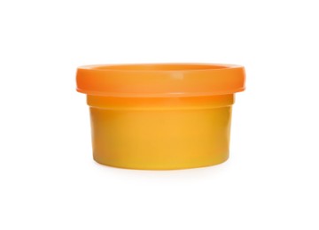 Plastic container of colorful play dough isolated on white