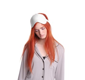 Young woman wearing pajamas and mask in sleepwalking state on white background
