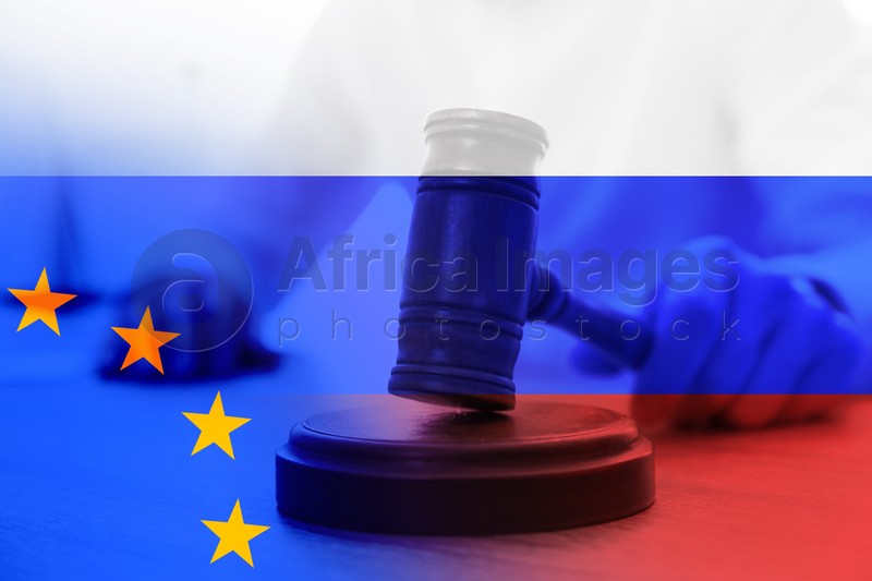 Multiple exposure of judge with gavel, Europenean Union and Russian flags. Concept of sanctions against Russia