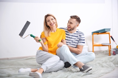 Young couple during apartment renovation, indoors