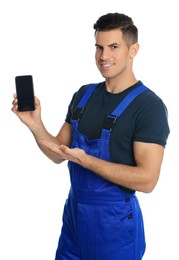 Repairman with modern smartphone on white background