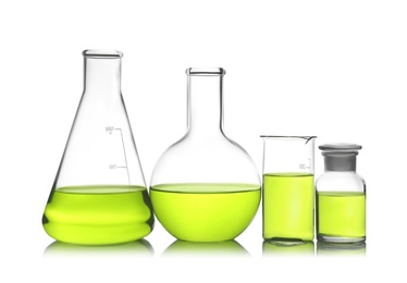 Laboratory glassware with color liquid on white background