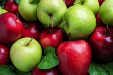 Photo of Fresh ripe green and red apples as background, closeup