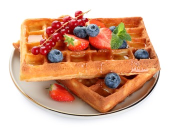 Photo of Delicious Belgian waffles with berries on white background