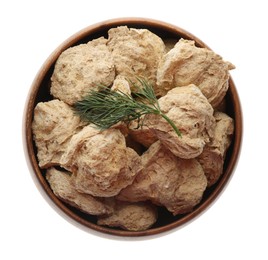 Dehydrated soy meat chunks with dill in bowl on white background, top view