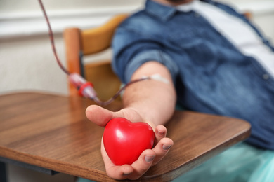 Man donating blood in hospital, closeup view