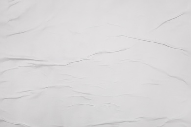 Top view of white creased blank poster as background, closeup