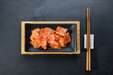 Delicious kimchi with Chinese cabbage served on grey table