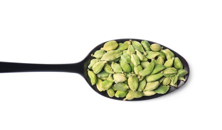 Spoon full of cardamom on white background, top view