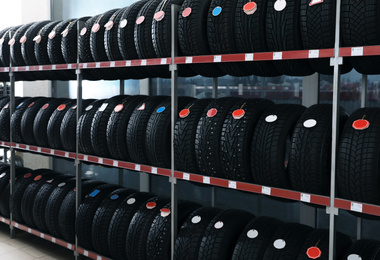 Car tires on rack in auto store