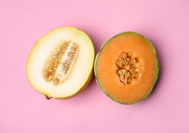Photo of Tasty colorful ripe melons on pink background, flat lay