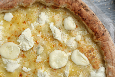 Photo of Delicious hot cheese pizza on grey table, top view