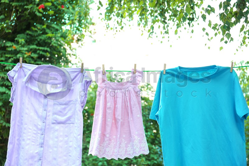 Clothes on laundry line outdoors on sunny day
