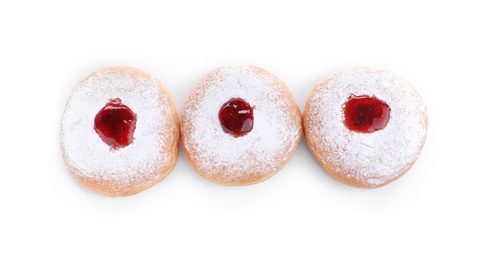 Hanukkah doughnuts with jelly and sugar powder on white background, top view