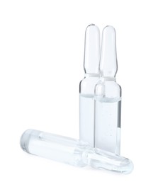 Pharmaceutical ampoules with medication on white background