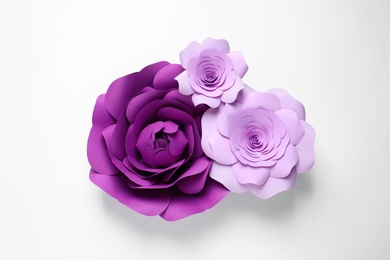 Photo of Different beautiful flowers of paper on white background, top view