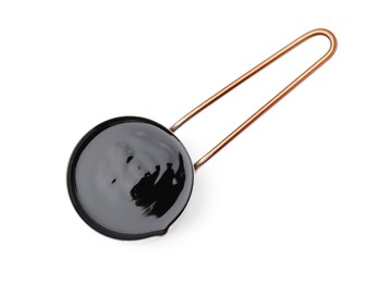 Photo of Metal small saucepan with balsamic glaze on white background, top view