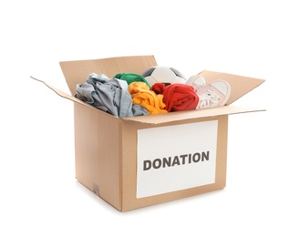 Carton box with donations on white background