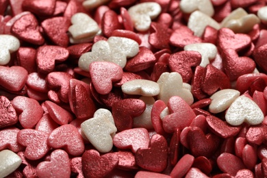 Sweet candy hearts as background, closeup view